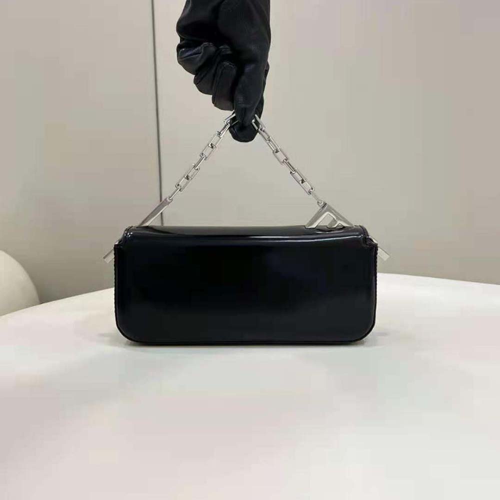 Side angle showing slim silhouette of Fendi Women First Sight Black Leather Mini Bag