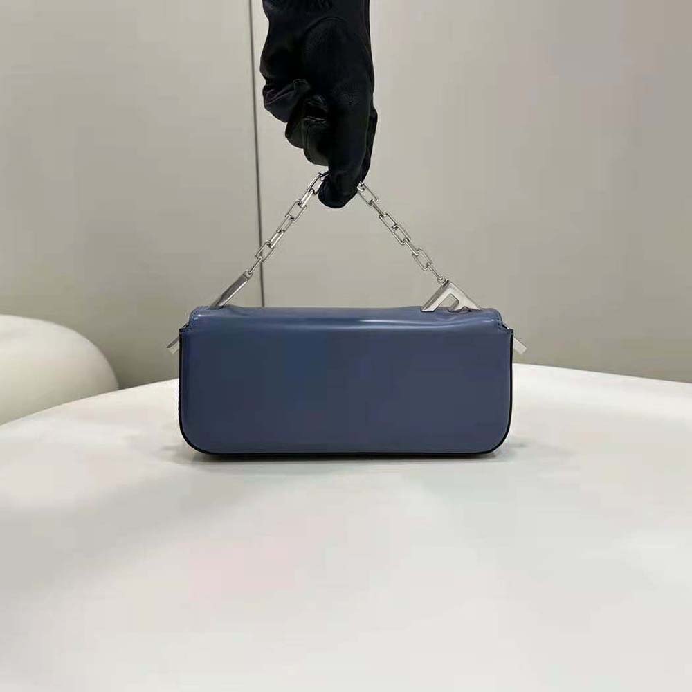 Side angle showing compact silhouette of Fendi Women First Sight Blue Leather Mini Bag