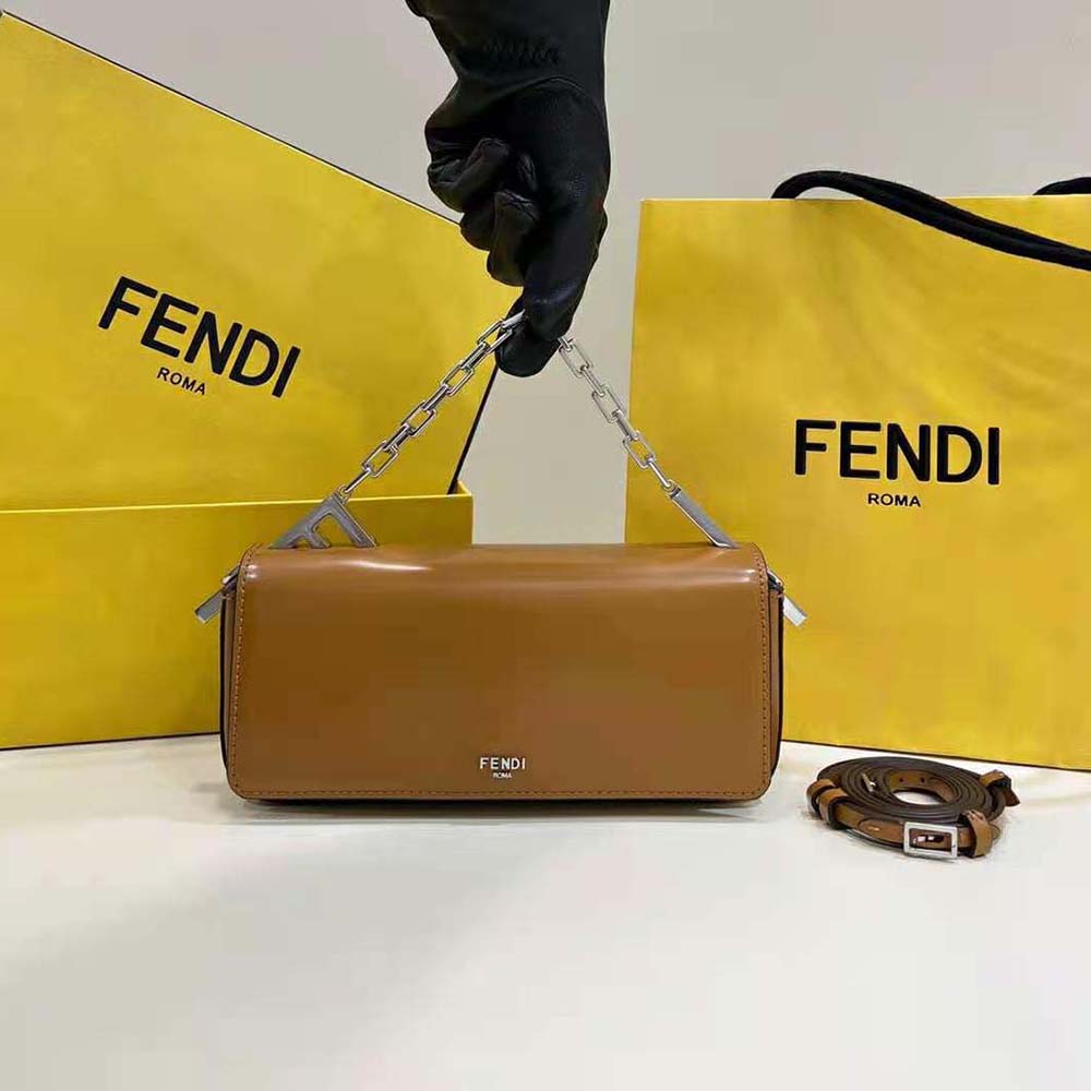 Close-up detail of gold logo clasp on Fendi Women First Sight Brown Leather Mini Bag