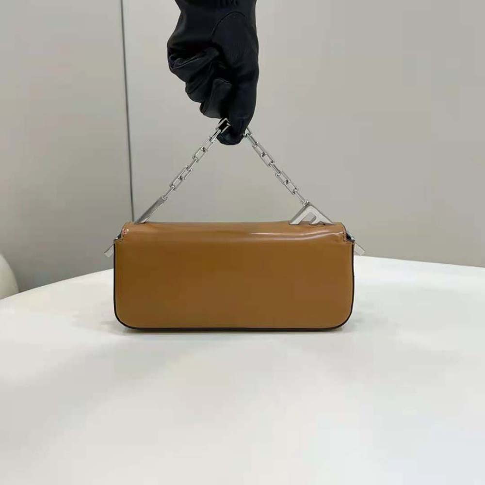 Side profile showing supple leather and compact shape of Fendi Women First Sight Brown Leather Mini Bag