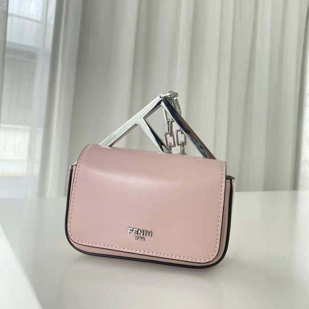 Close-up of pink leather texture and gold hardware on Fendi Nano Bag F