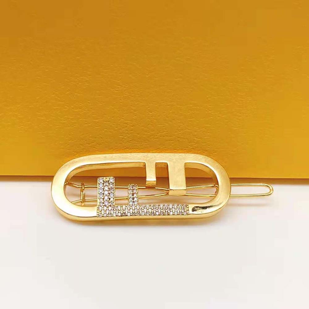 Side angle of Fendi Women O’Lock Hair Clip Gold-Coloured clasp open