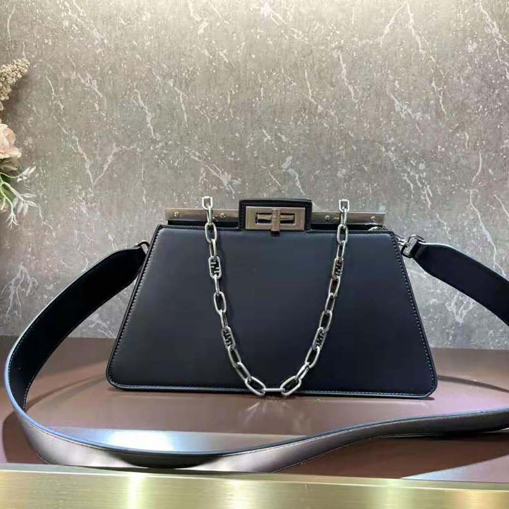 Side profile showing silhouette of Fendi Women Peekaboo Cut Medium Black Leather Bag