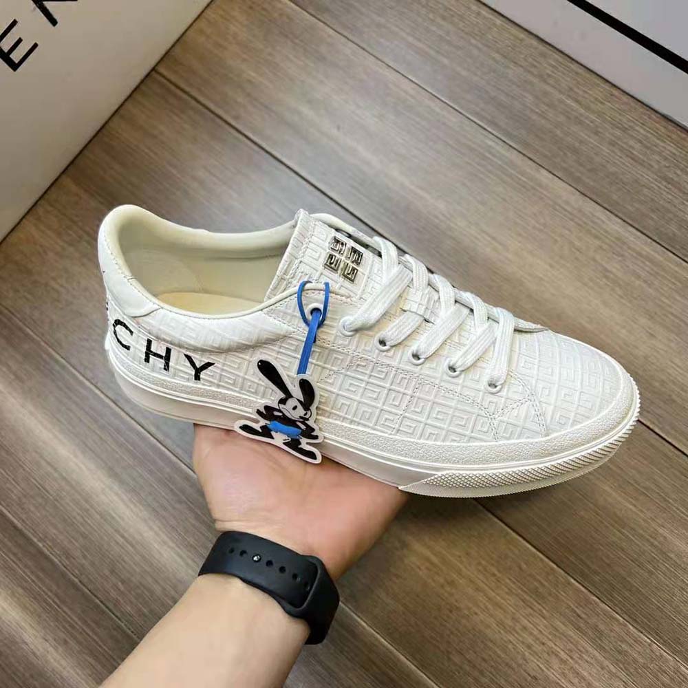 Close-up detail of white leather and embossed Givenchy logo on sneaker