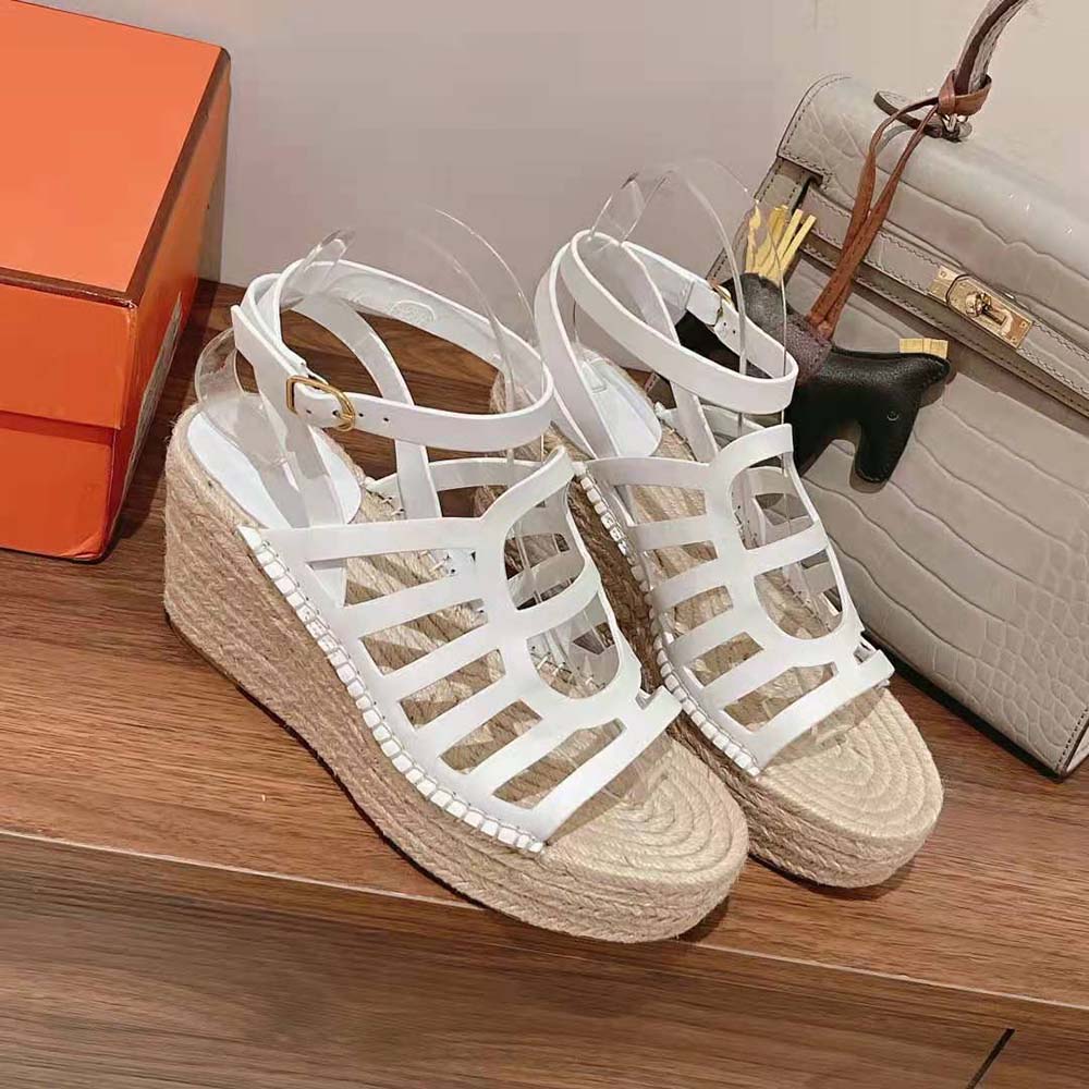 Top-down angle showing white calfskin and espadrille wedge of Hermes Women Catalya Espadrille