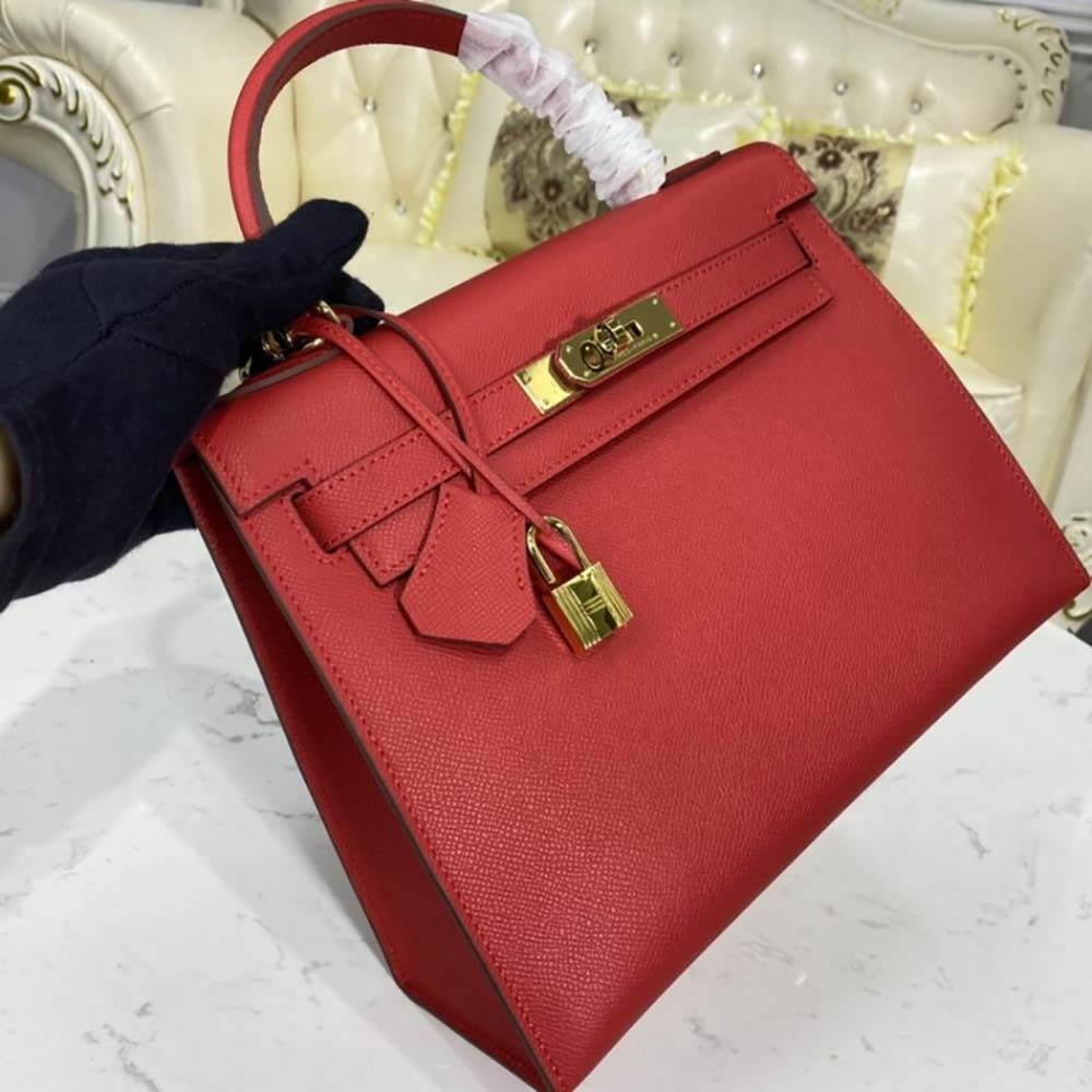 Side profile of Hermes Women Kelly Bag 28 Epsom Leather-Red highlighting leather texture