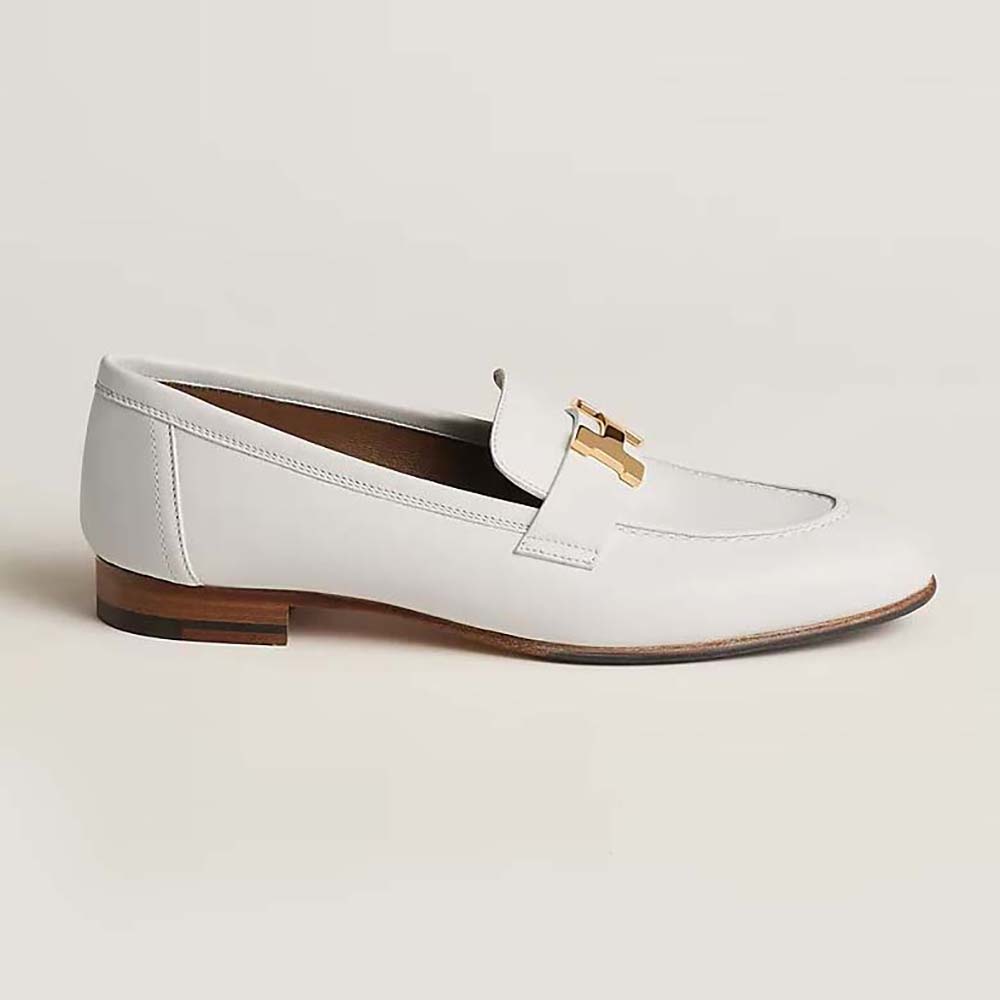 Side profile of Hermes Women Paris Loafer white calfskin with palladium ‘H’