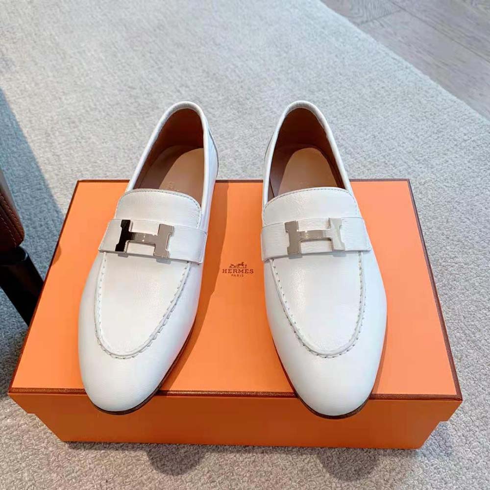 Close-up of palladium plated ‘H’ detail on Hermes white calfskin loafer