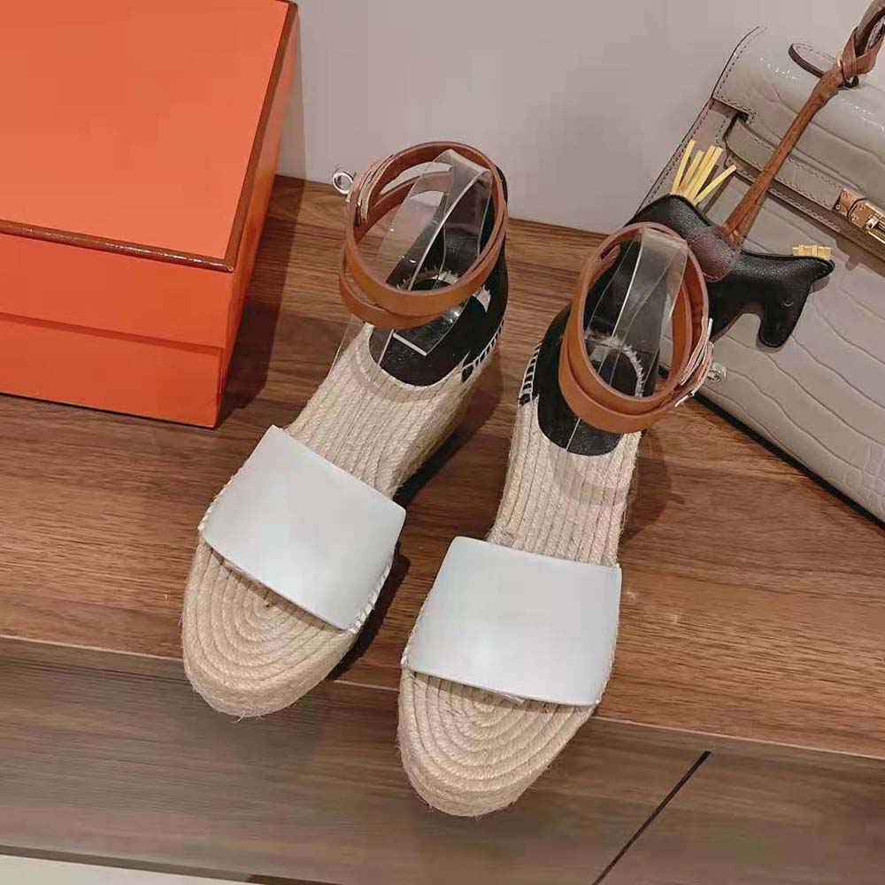 Close-up of wrap-around ankle strap detail on Hermes espadrille