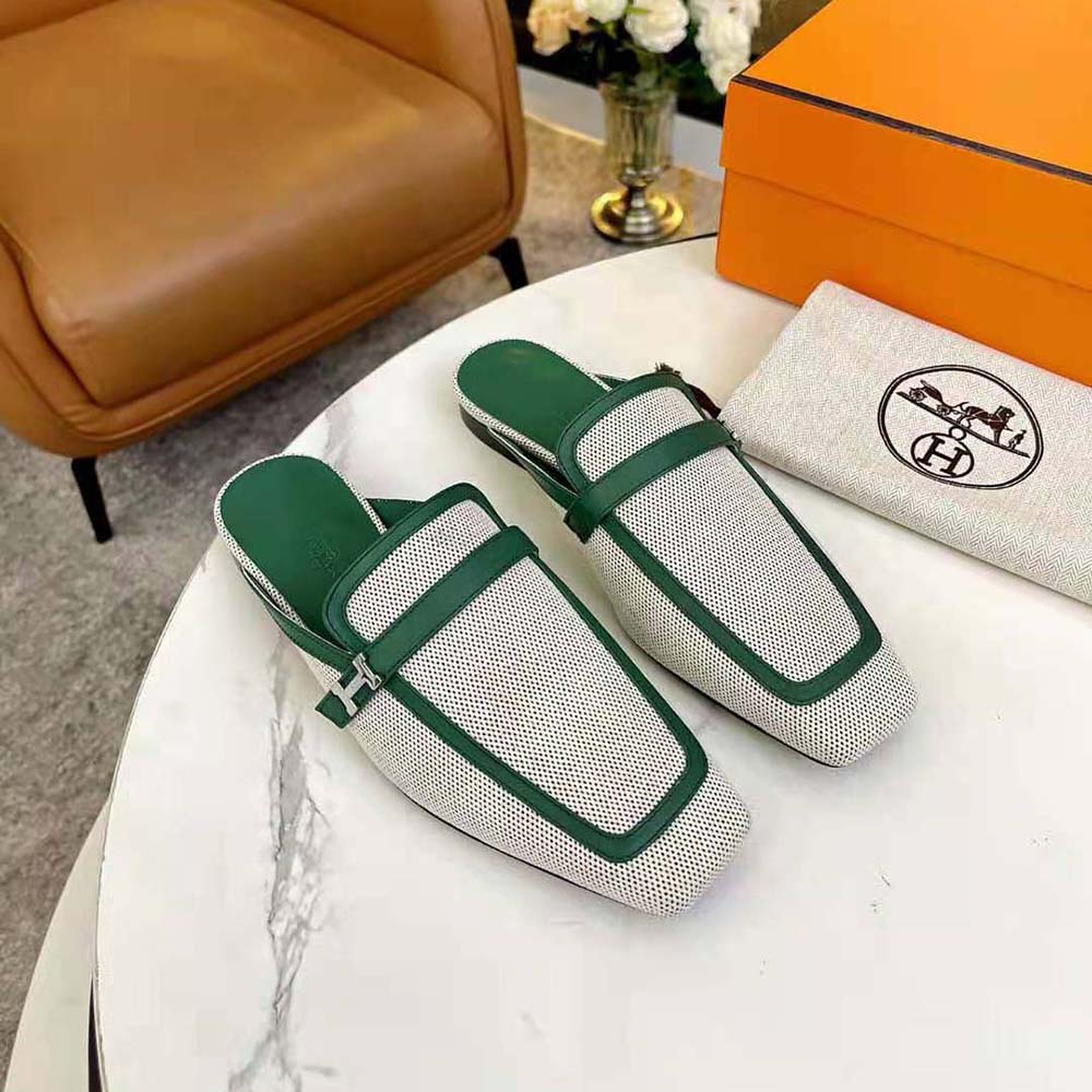 Close-up of green calfskin and H hardware detail on Hermes sandal