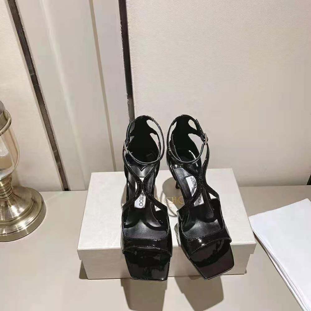 Close-up of ankle strap and gold buckle on Jimmy Choo Azia 110 sandals