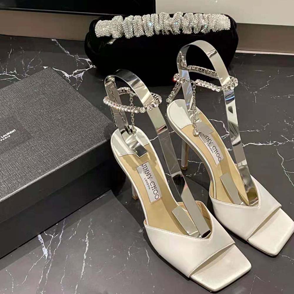 Close-up of crystal embellishment on Jimmy Choo Women Saeda Sandal 100