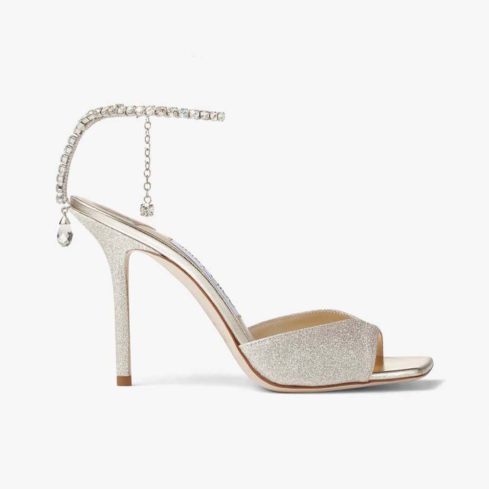 Front angle of Jimmy Choo Women Saeda Sandal 100 in platinum glitter