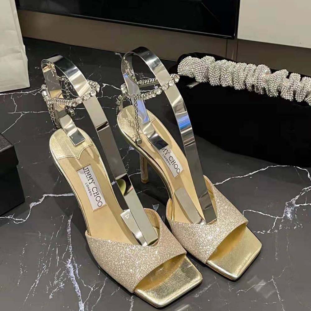 Close-up of crystal embellishment on Jimmy Choo Women Saeda Sandal 100 strap