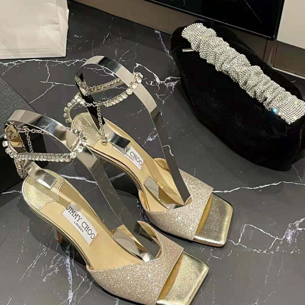 Side profile showcasing heel height of Jimmy Choo Women Saeda Sandal 100