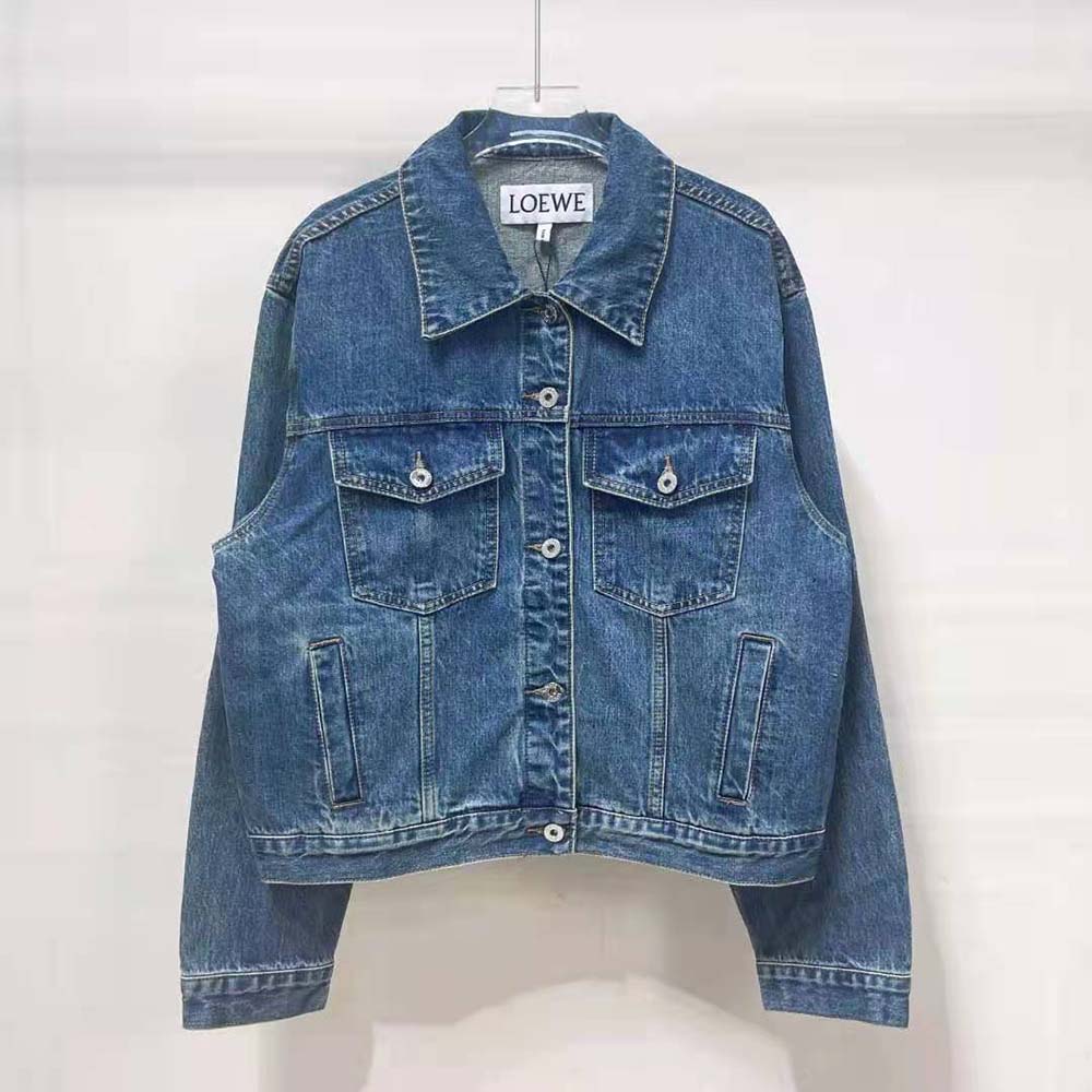 Close-up of Anagram embroidery detail on Loewe denim jacket sleeve
