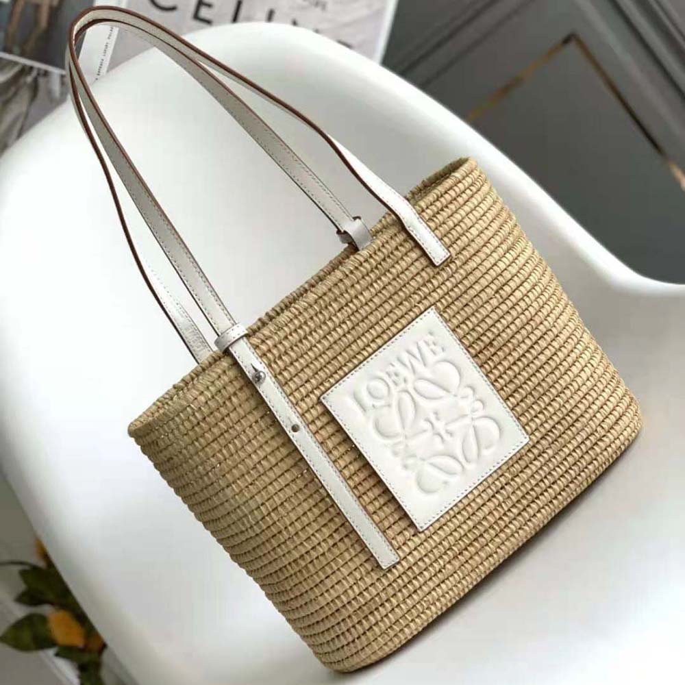 Close-up of gold-tone hardware and leather flap on Loewe Small Square Basket Bag