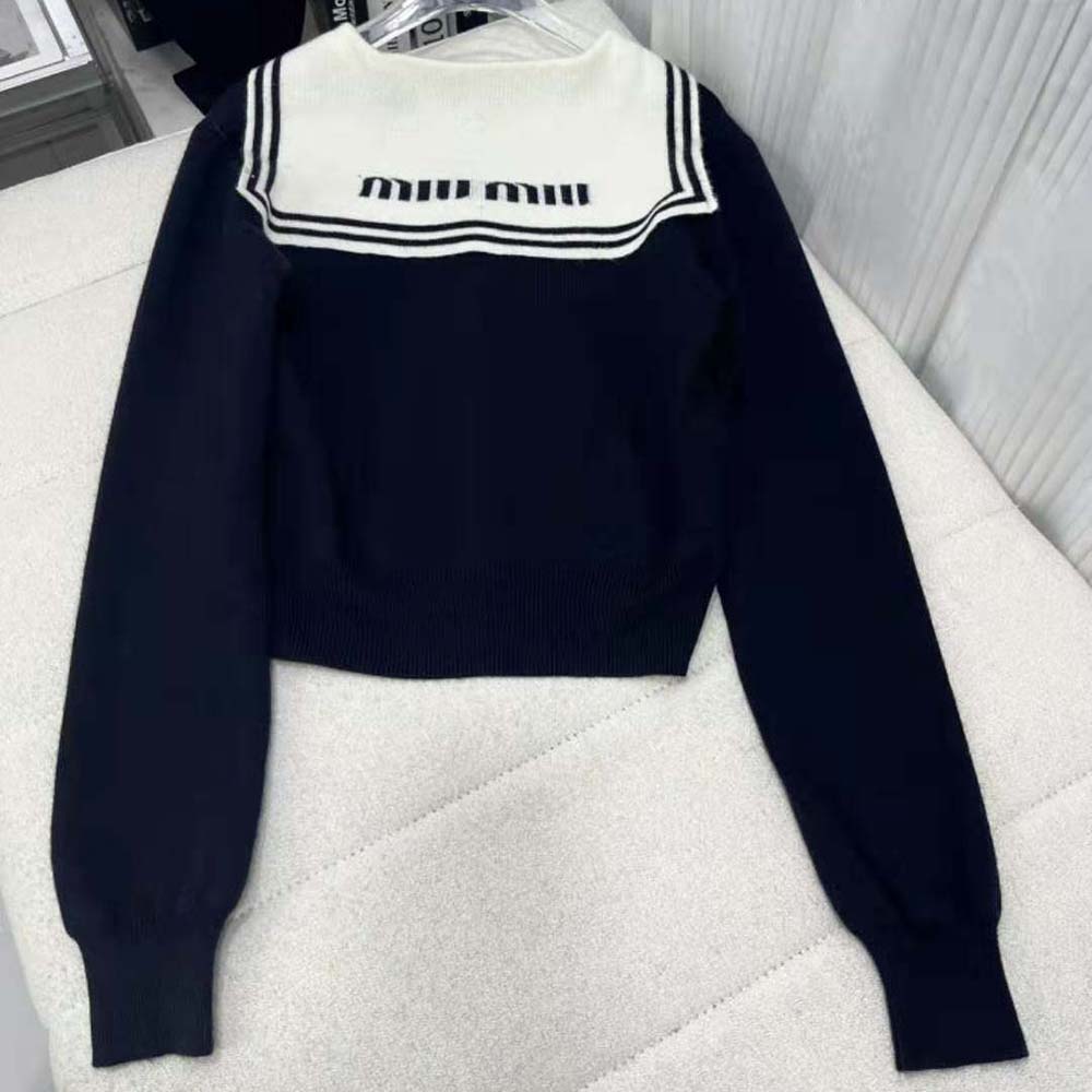 Side angle showing relaxed fit of Miu Miu Women Cashmere Cardigan