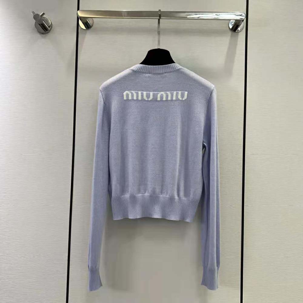 Side angle showing relaxed fit of Miu Miu Cashmere Crew-Neck Sweater-Blue