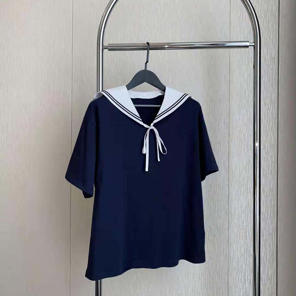 Side angle showing relaxed fit of Miu Miu Women Cotton T-shirt with Embroidered Logo