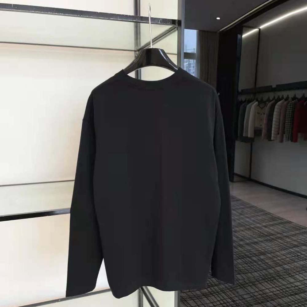 Side angle showing relaxed fit of Miu Miu Women Cotton T-shirt black