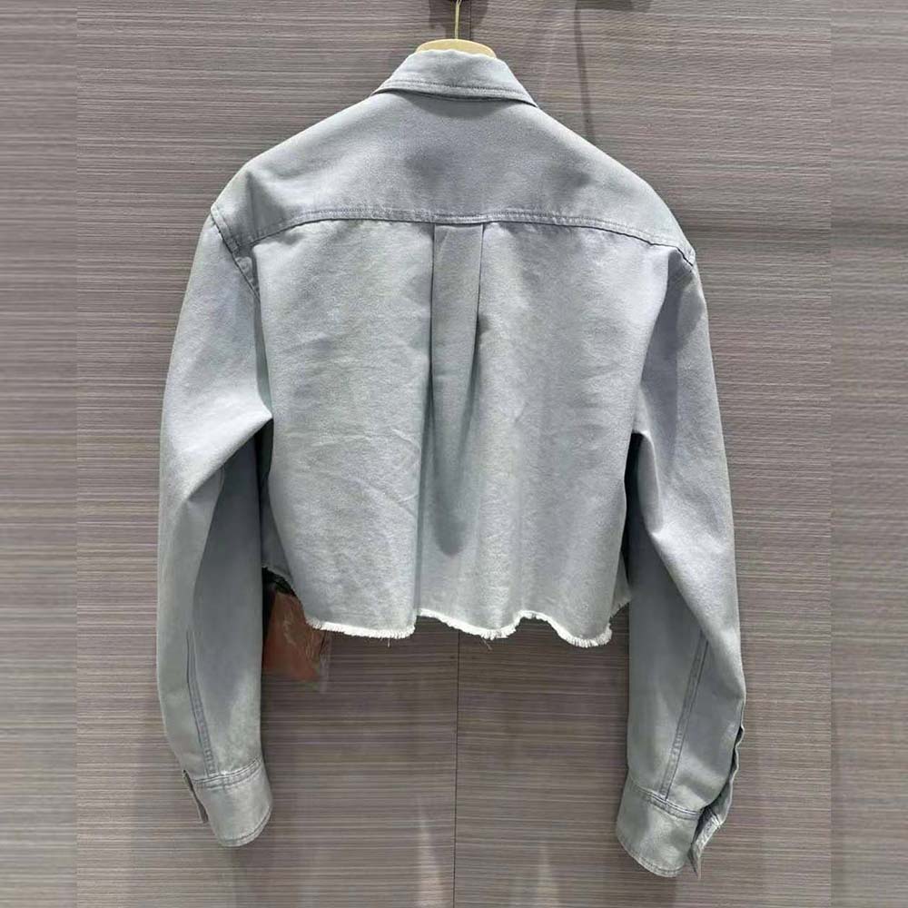 Side angle showing relaxed fit of Miu Miu Women Denim Shirt