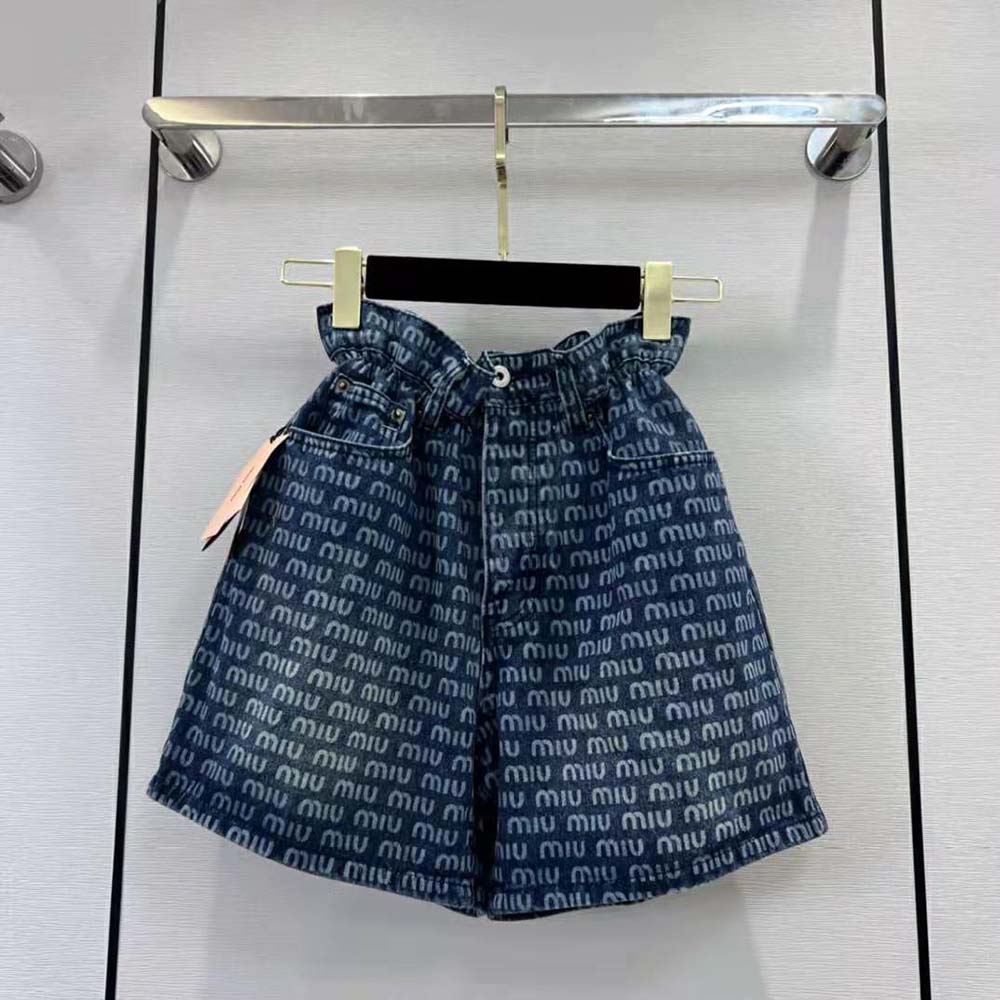 Side profile of blue Miu Miu Women Denim Shorts showing mid-rise fit