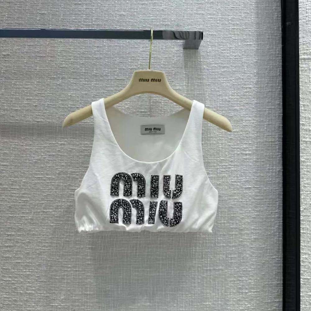 Close-up of embroidered logo detail on Miu Miu jersey top