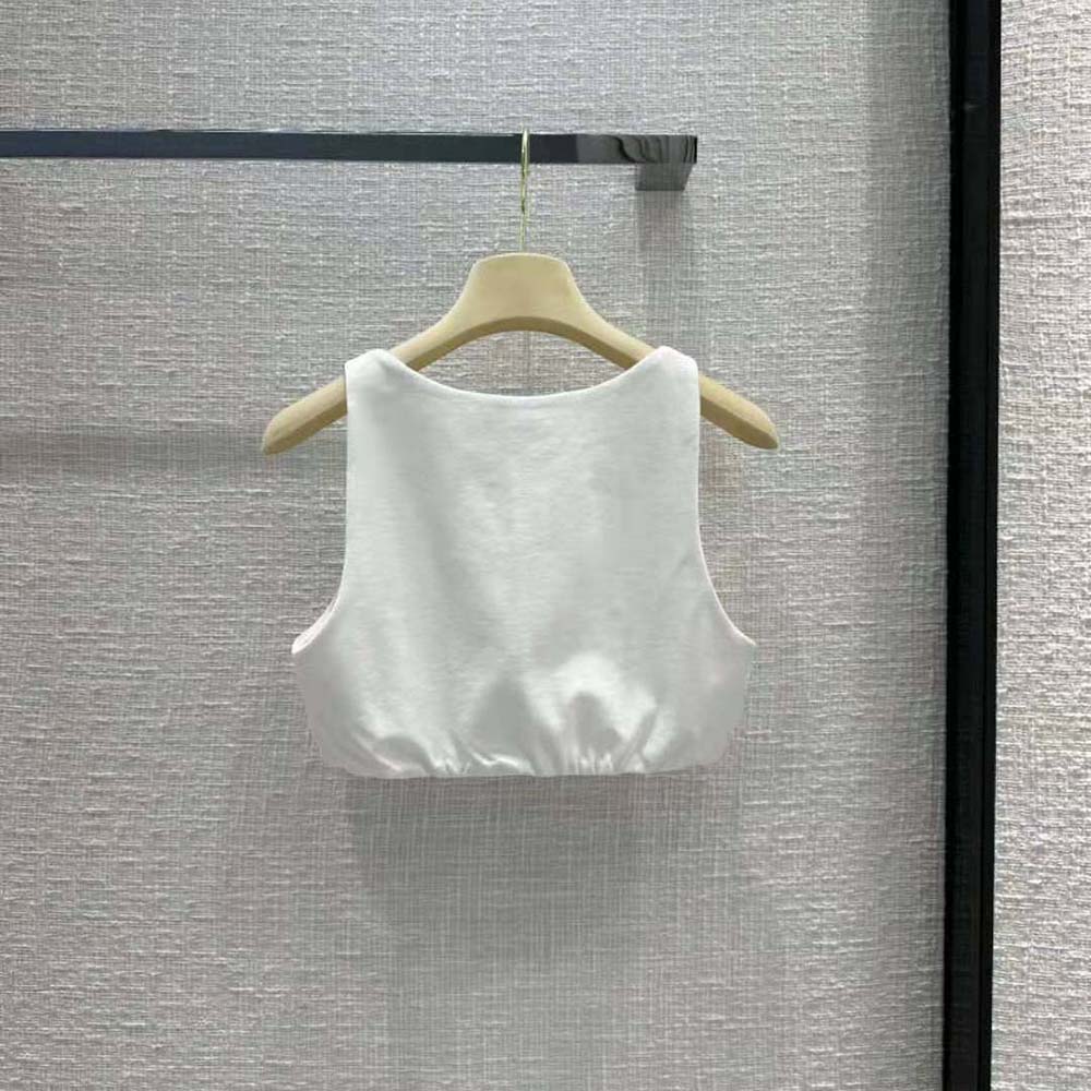 Side angle showing relaxed fit of Miu Miu embroidered jersey top