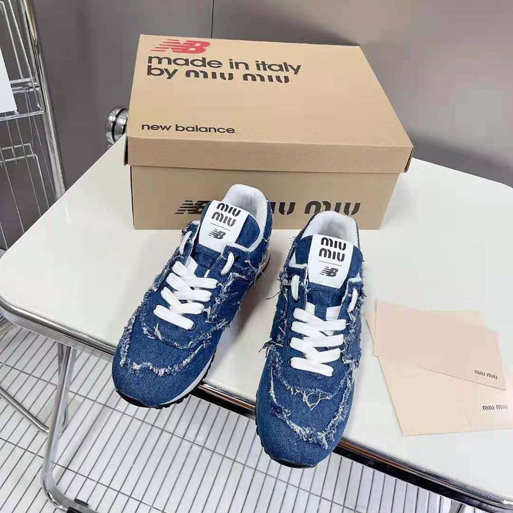 Close-up of blue denim and metal logo on Miu Miu denim sneakers