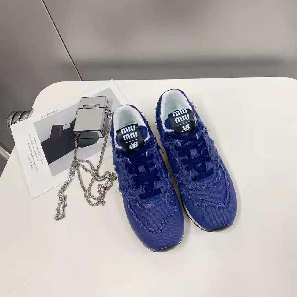 Close-up on navy denim and suede details of Miu Miu Denim Sneakers