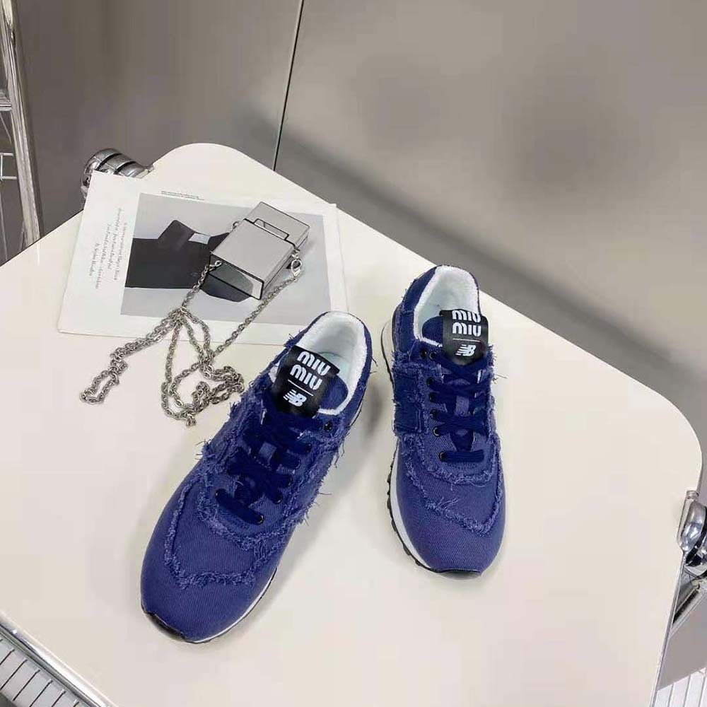 Top-down look at laces and logo hardware on Miu Miu Denim Sneakers-Navy