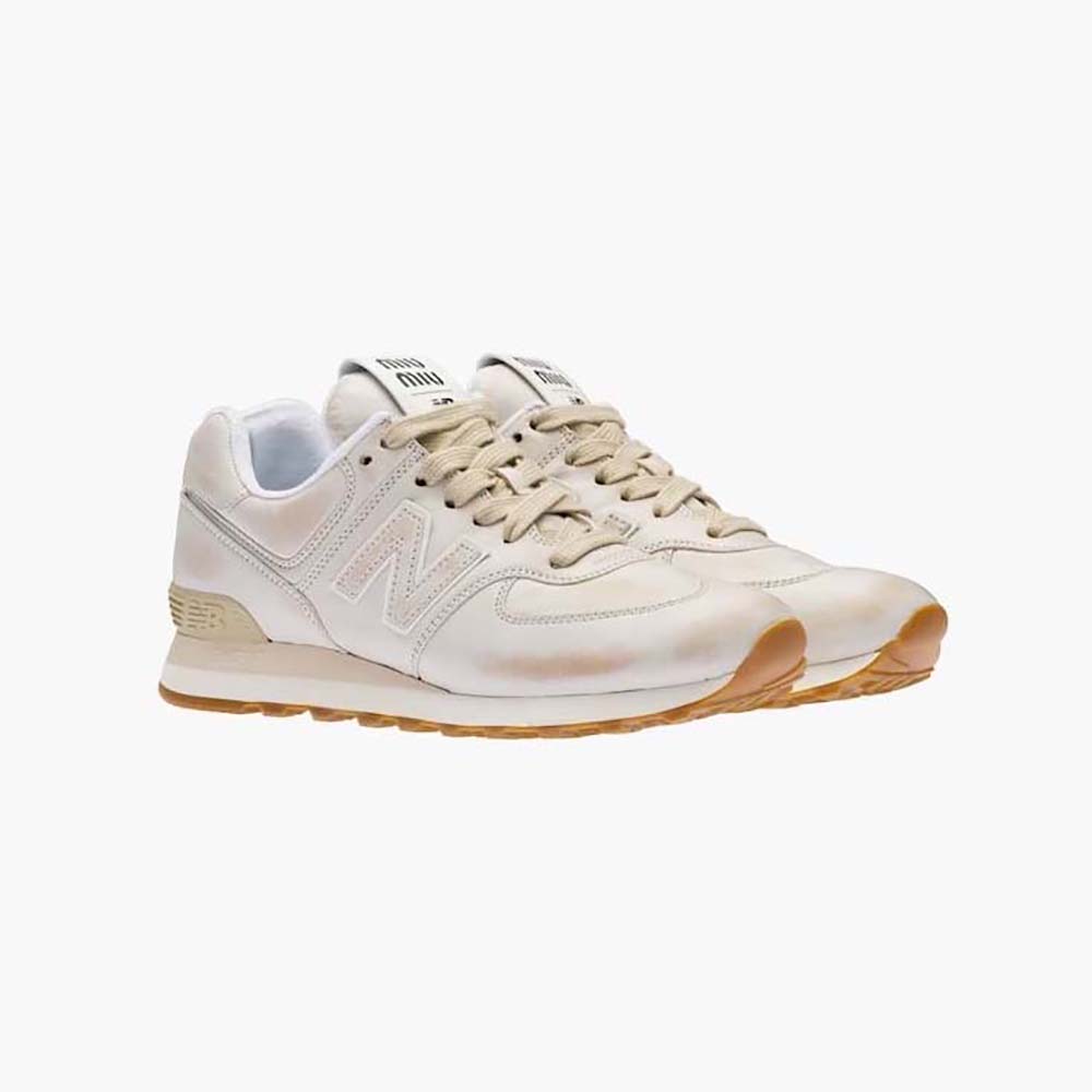 Side profile of Miu Miu Women New Balance 574 x Miu Miu Vintage-Effect Nappa Leather Sneakers in white