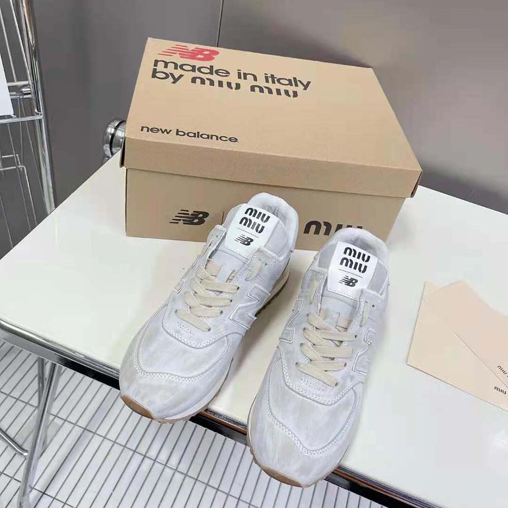 Close-up detail of distressed nappa leather on Miu Miu Women New Balance 574 x Miu Miu sneakers