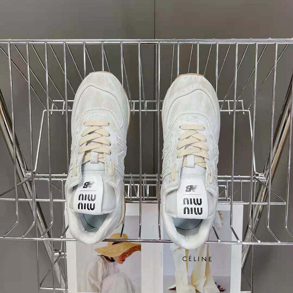 Top view showing lace-up closure and subtle Miu Miu logo hardware on white sneakers