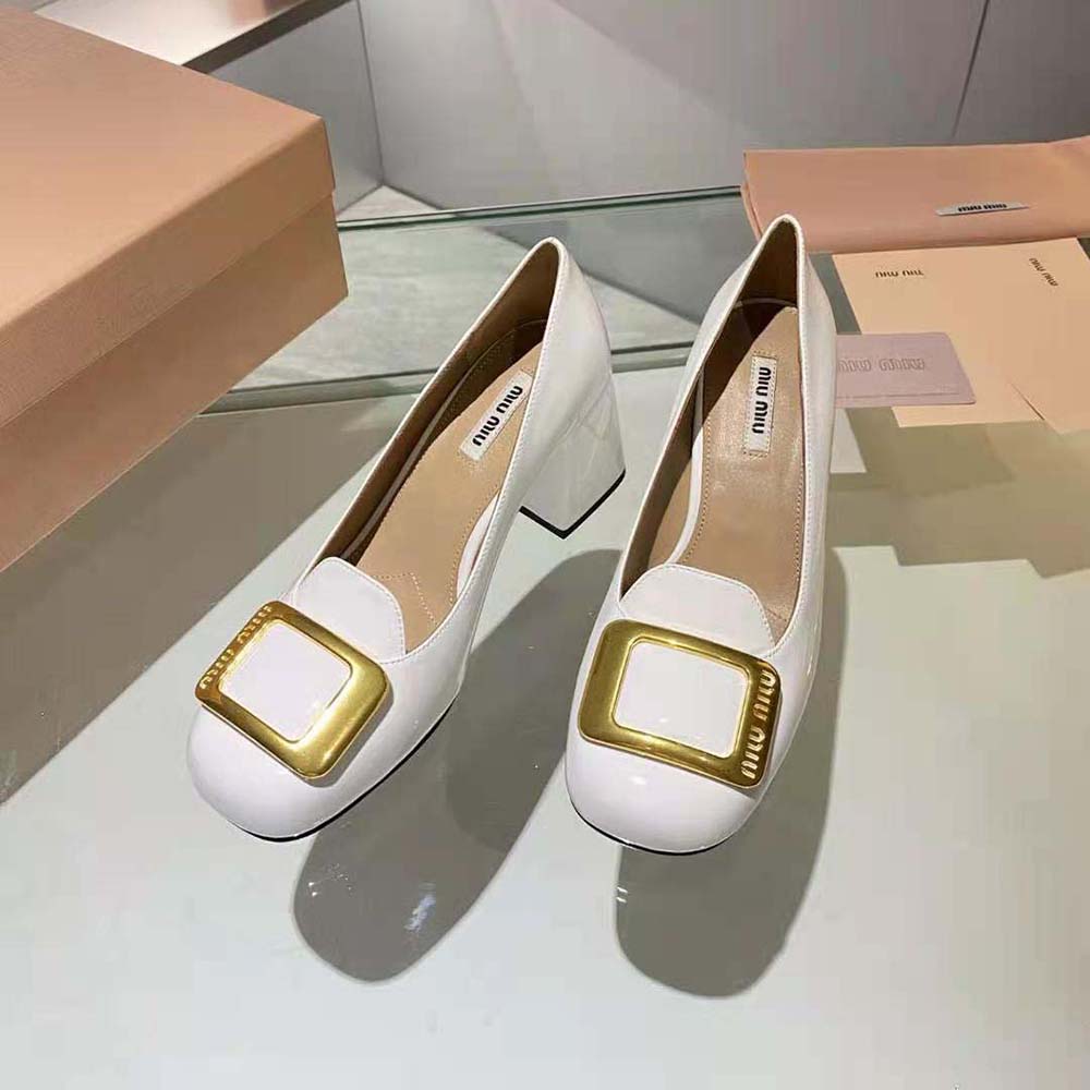 Rear angle highlighting the 65 mm white heel on Miu Miu pumps
