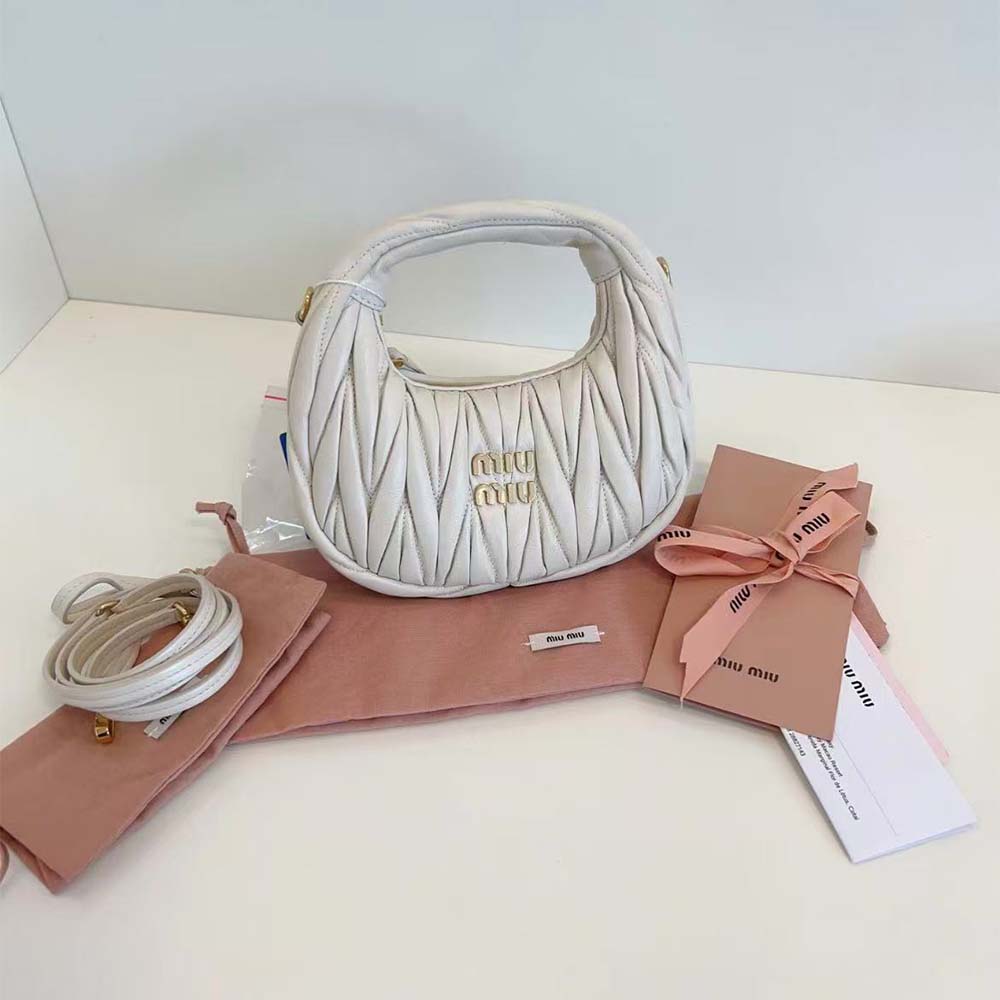 Close-up detail of matelassé quilting on Miu Miu Women Wander Hobo Mini-Bag