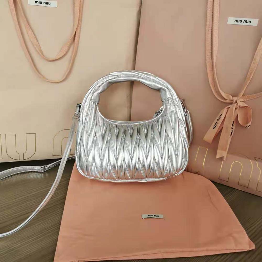 Side angle showcasing the compact silhouette of the Miu Miu mini-bag