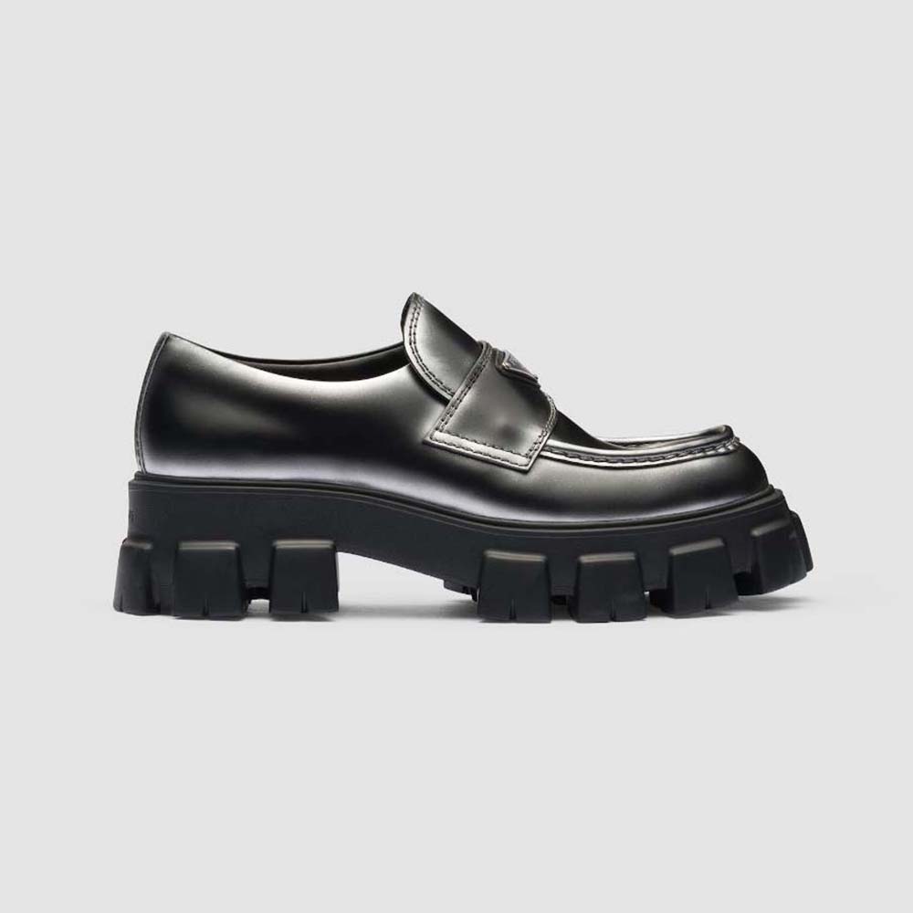 Side profile of Prada Men Monolith Nuanced Brushed Leather Loafers in black