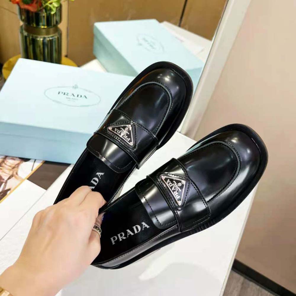 Top view of Prada Women Brushed Leather Loafers-Black highlighting cushioned interior