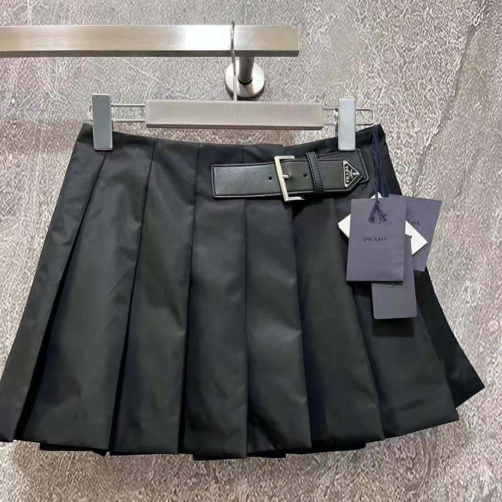 Close-up of enameled metal triangle logo on Prada Women Gabardine Miniskirt