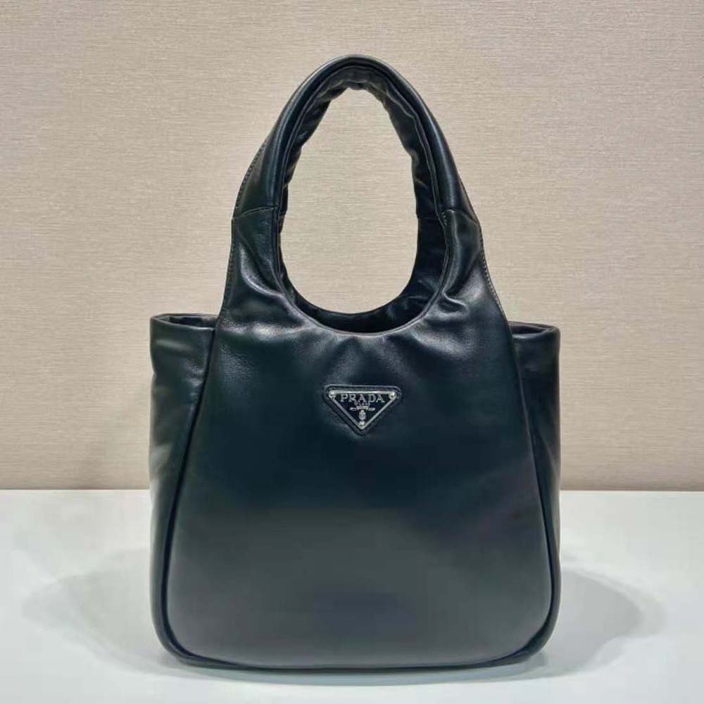 Close-up of padded soft nappa leather and silver hardware on Prada bag