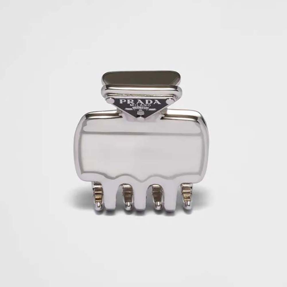 Close-up of Prada Women Metal Hair Clip with enameled triangle logo