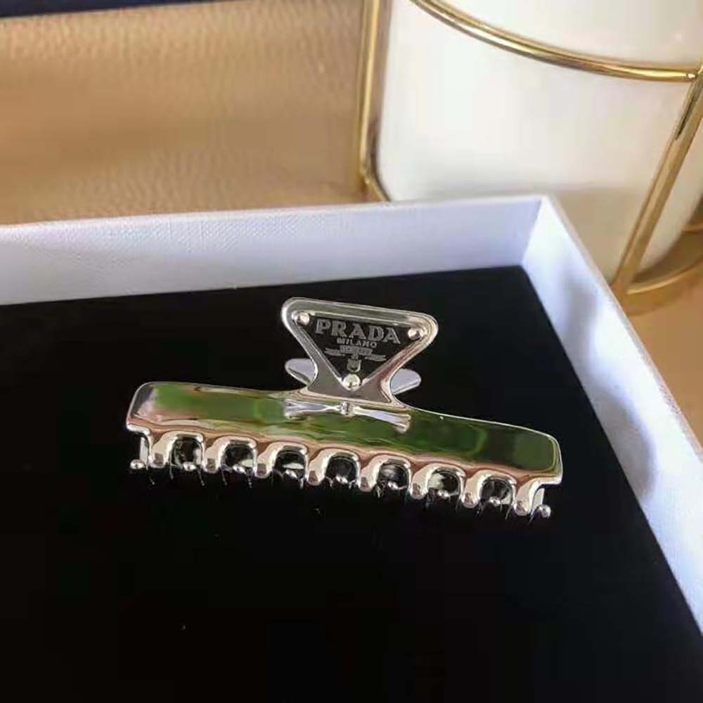 Side view of Prada Women Metal Hair Clip curved silhouette