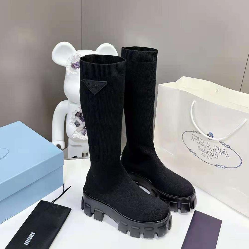 Top-down shot showing lace-up closure on Prada Monolith Knit Boots