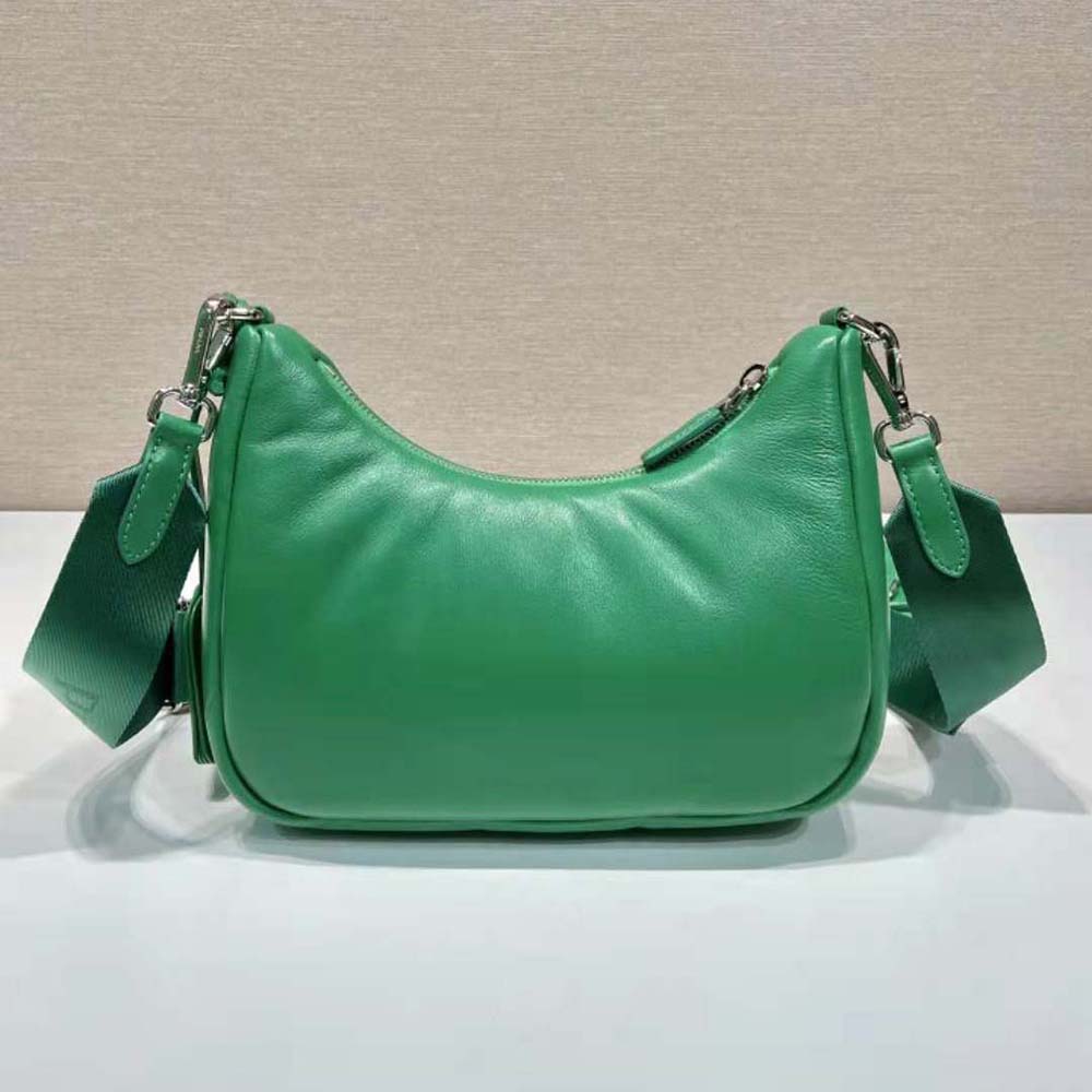 Side angle showing padded leather and strap details of Prada Re-Edition 2005 bag