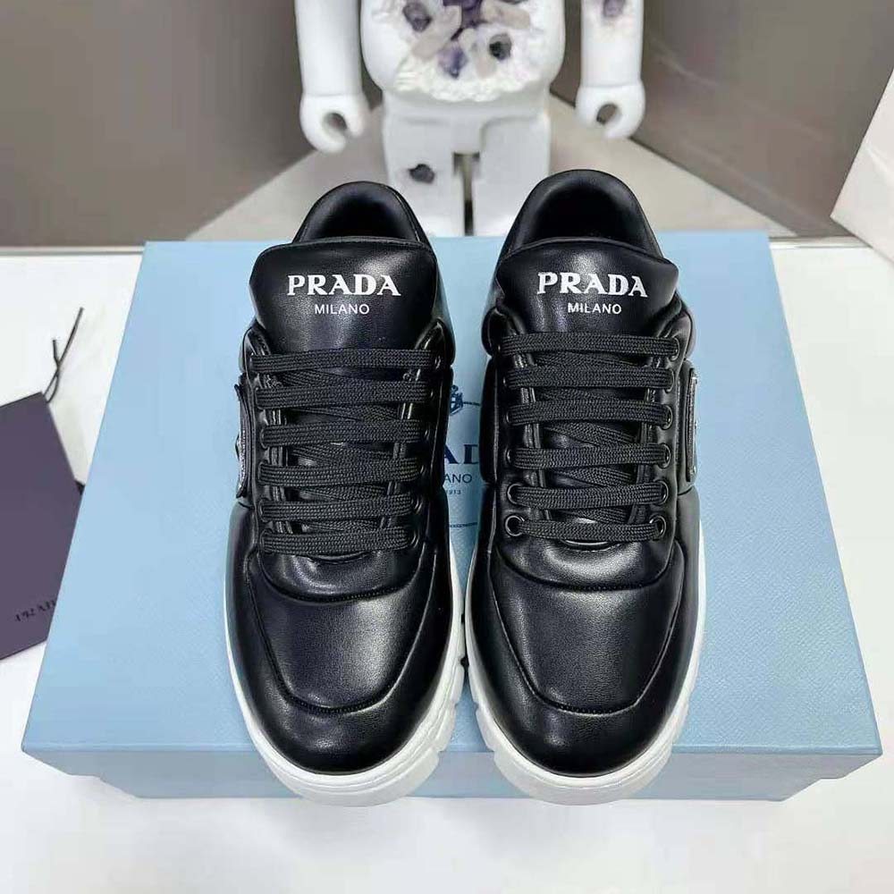 Close-up of black Prada Women Padded Nappa Leather Sneakers lace and logo detail