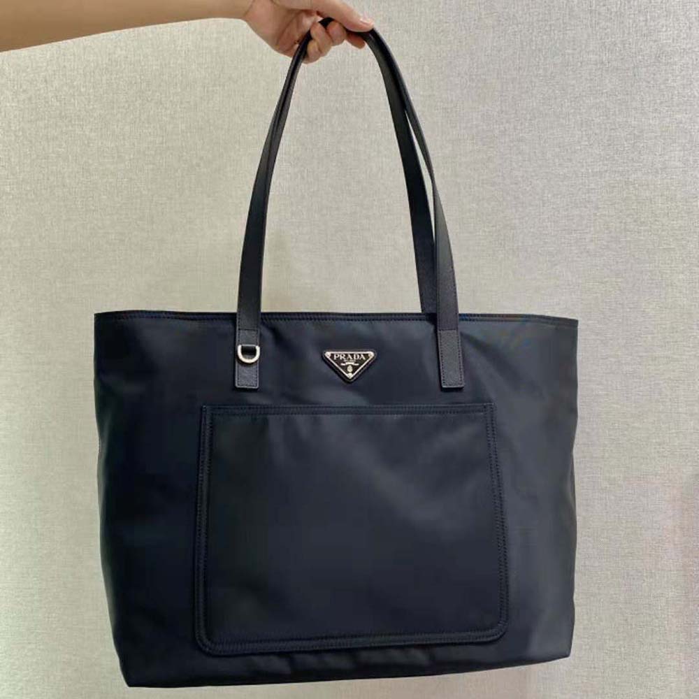 Close-up on silver-tone hardware and Prada logo detail on tote
