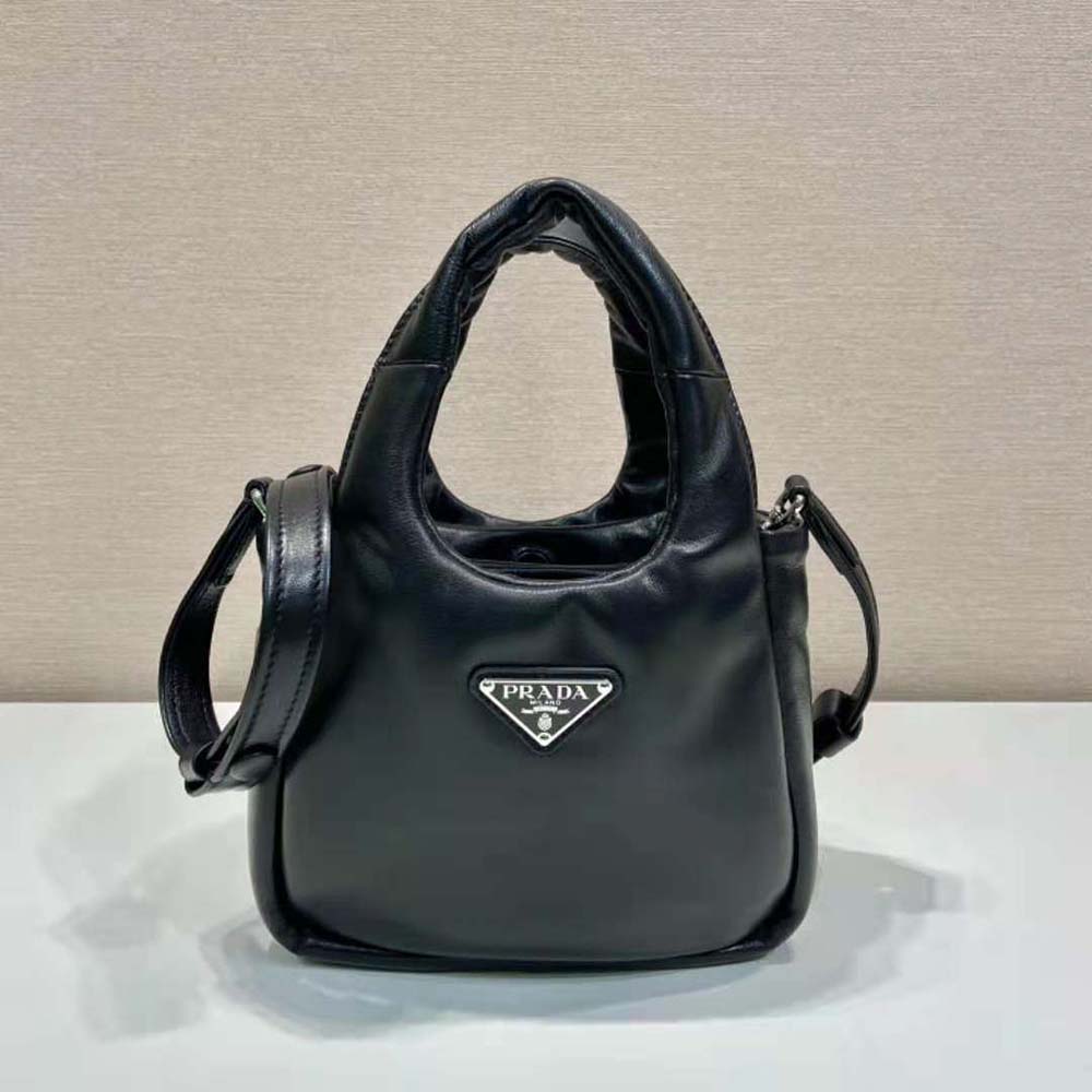 Close-up of padded black nappa leather and silver hardware detail
