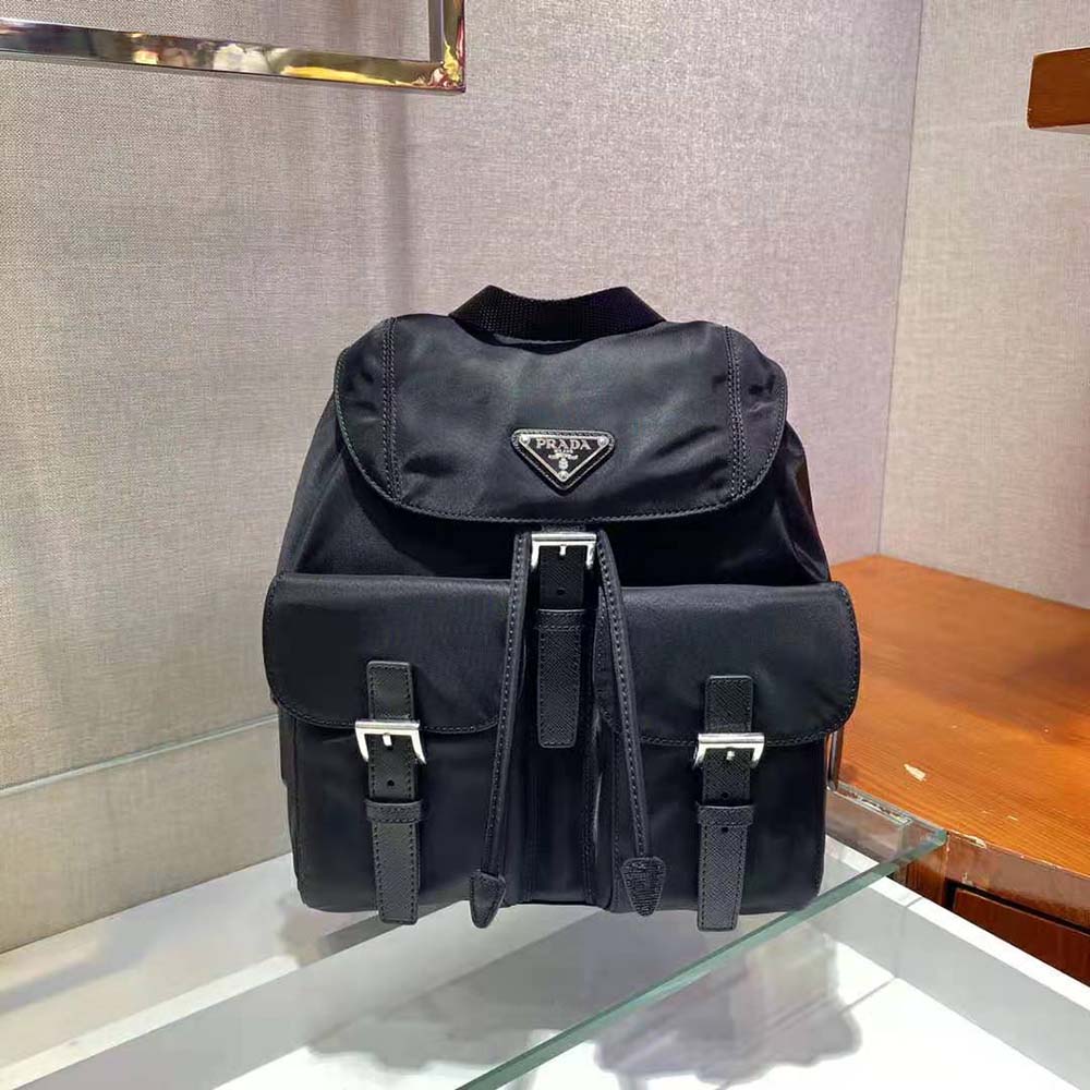 Side angle highlighting silver hardware on Prada Women Small Re-Nylon Backpack-Black
